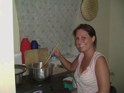 Chelsea, a volunteer in Kenya, helps in preparing a meal.